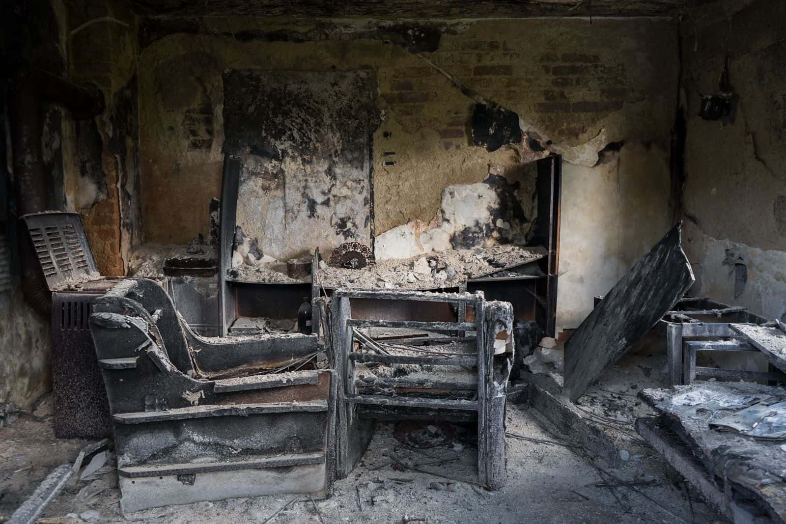 Fire-damaged room with openings needing to be secured