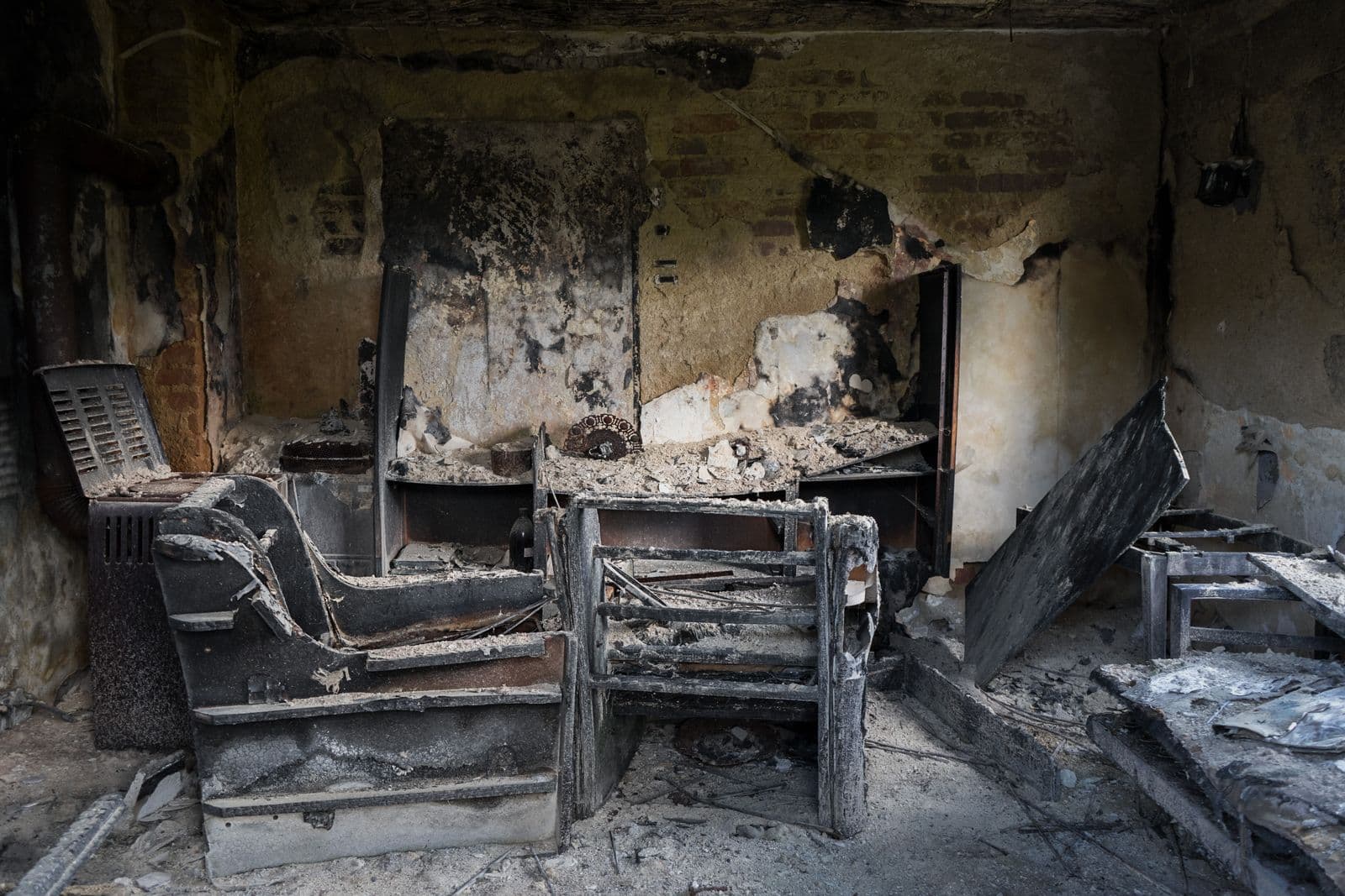 Fire-damaged room with openings needing to be secured